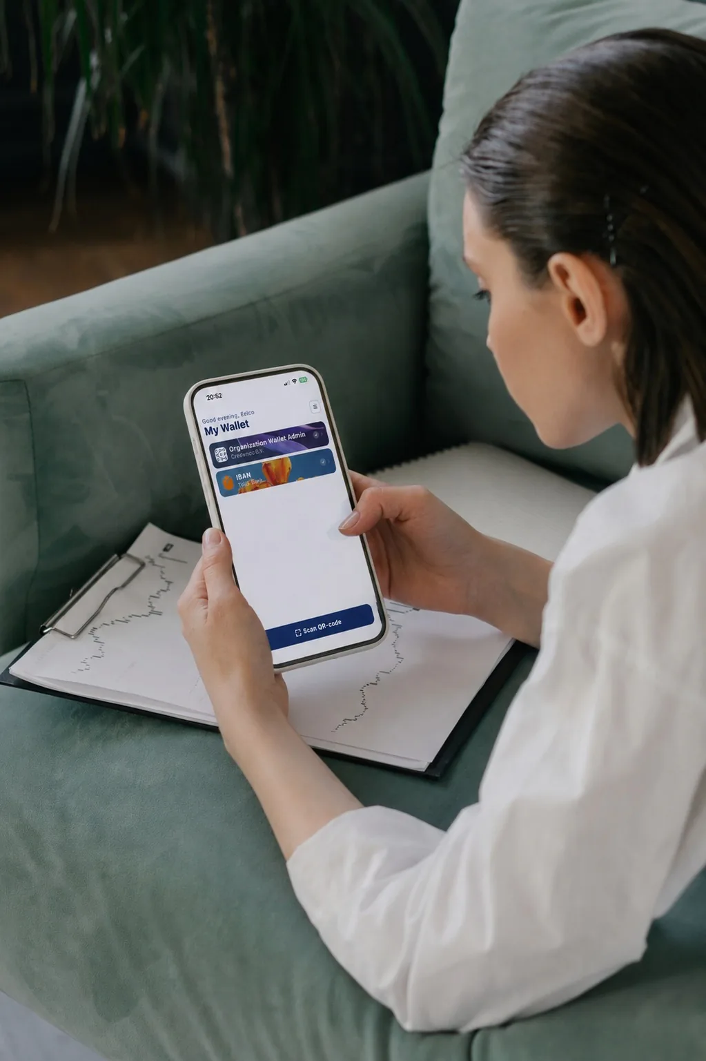 Someone presenting a digital credential from the Credenco Wallet app on a phone